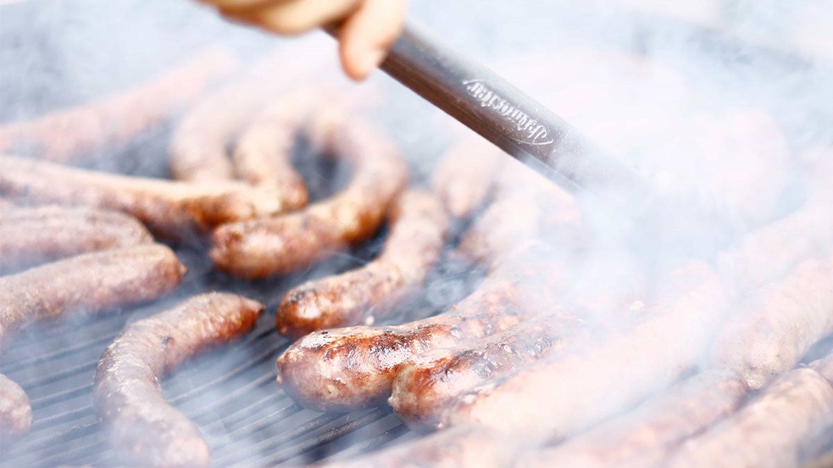 Sausages Smoking on a Grill