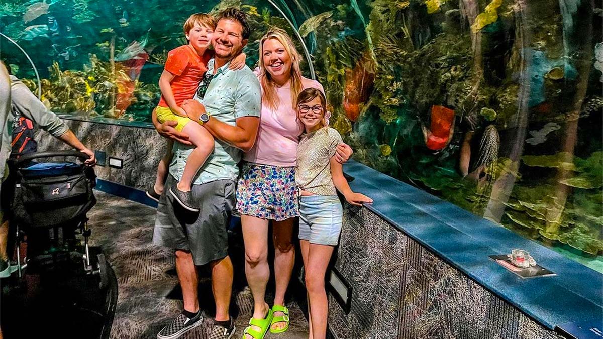 Family posing for photo at Ripley’s Aquarium of the Smokies - Pigeon Forge, Tennessee, USA