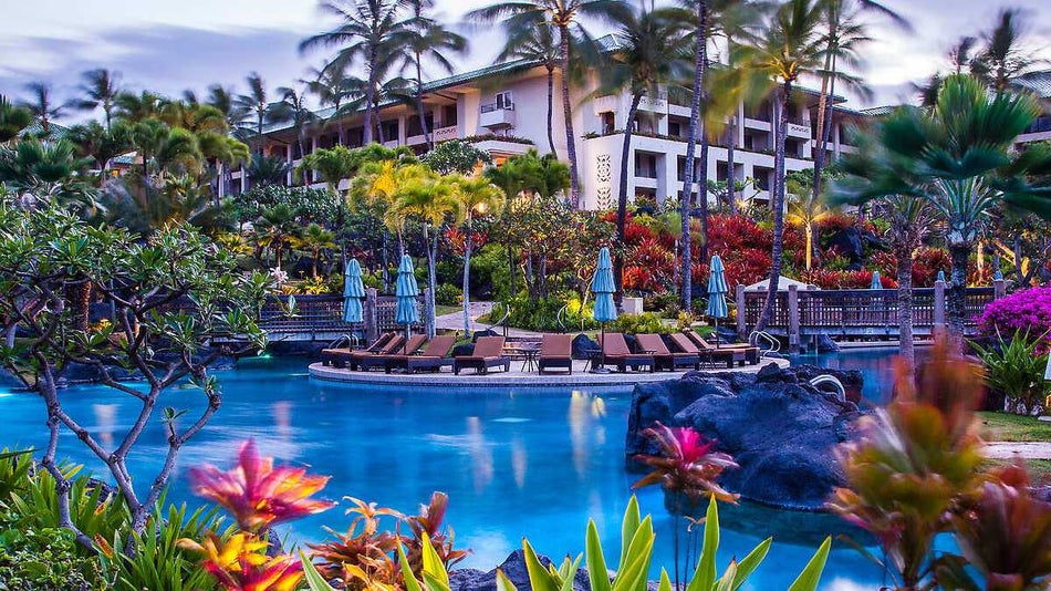exterior view of outdoor pool and plants at the Grand Hyatt Kauai Resort & Spa in Kauai, Hawaii, USA