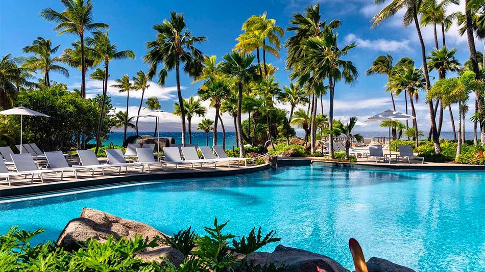 exterior ground view of outdoor pool with palm trees at Westin Maui Resort in Maui, Hawaii, USA