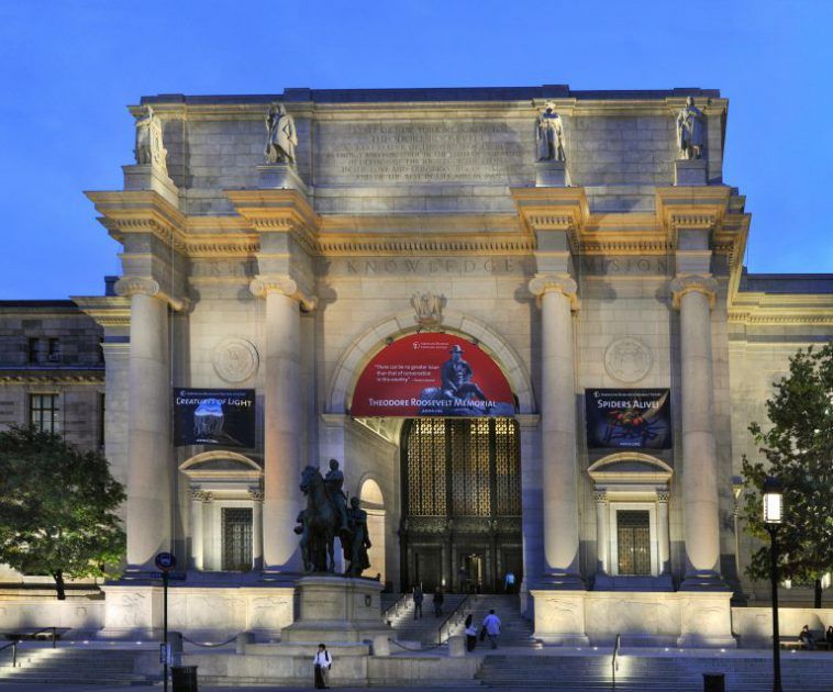 evening view of the main entrance to the American Museum of Natural History with uplighting in NYC, New York, USA