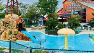 exterior view of Grand Country Resort with outdoor pool and slide in Branson, Missouri, USA