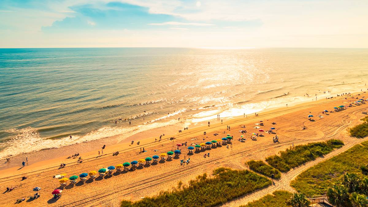aerial view along coastline with people lounging and swimming in Myrtle Beach, South Carolina, USA
