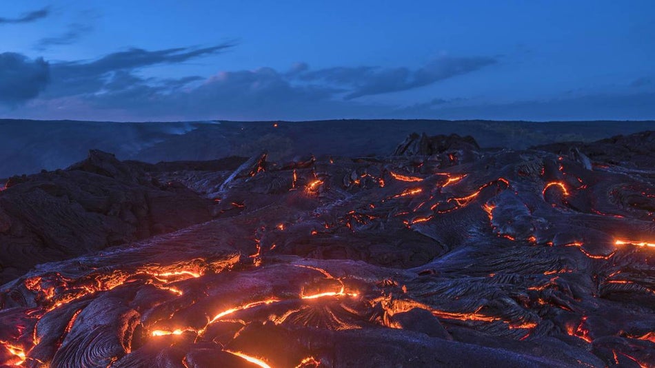 night sky over lava flow and volcanoes at Hawaiʻi Volcanoes National Park - Big Island, Hawaii, USA