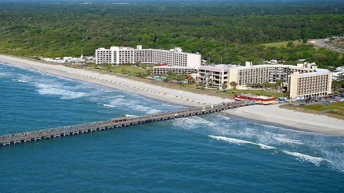 exterior view of Doubletree Resort by Hilton Myrtle Beach Oceanfront with pier in Myrtle Beach, South Carolina, USA