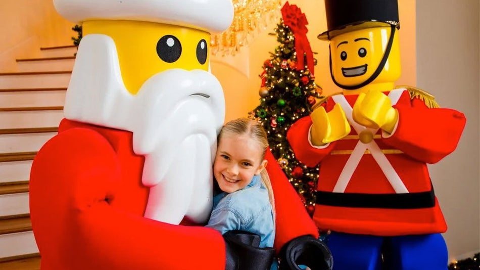 girl hugging Lego character at LEGOLAND breakfast