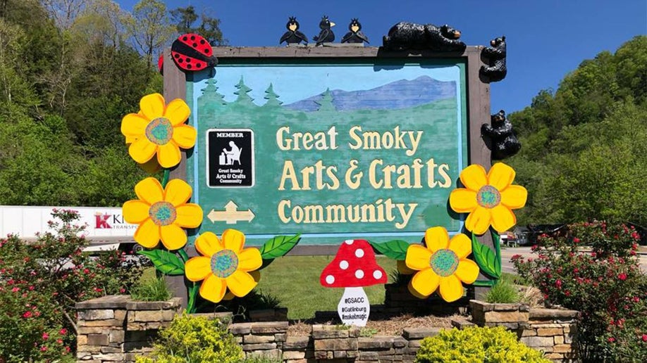 Great Smoky Arts and Crafts Community Sign with flowers on it for spring in Gatlinburg, Tennessee, USA