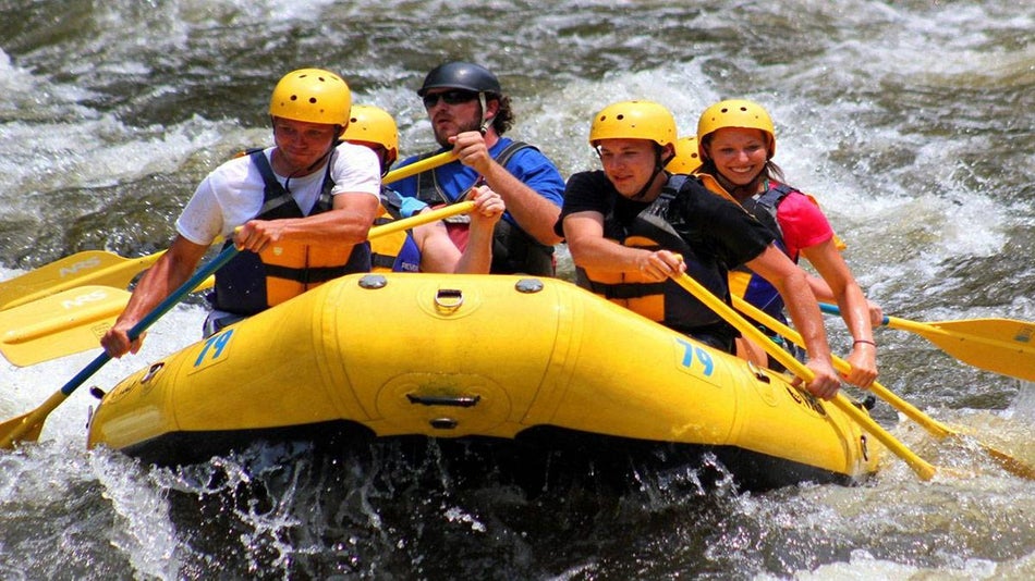 Group of People White Water Rafting