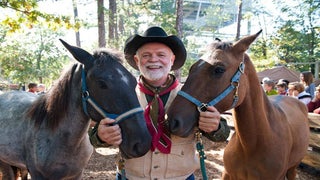 Man with two horses at Silver Dollar City's National Harvest & Cowboy Festival