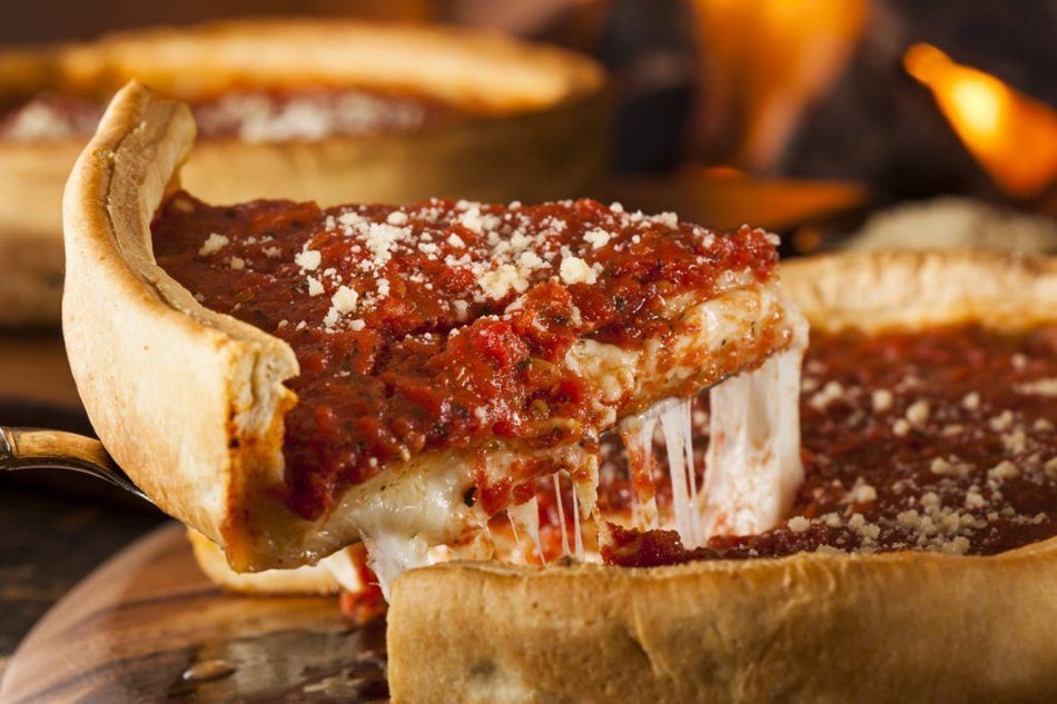 close up of a slice of chicago deep dish pizza in Chicago, Illinois, USA