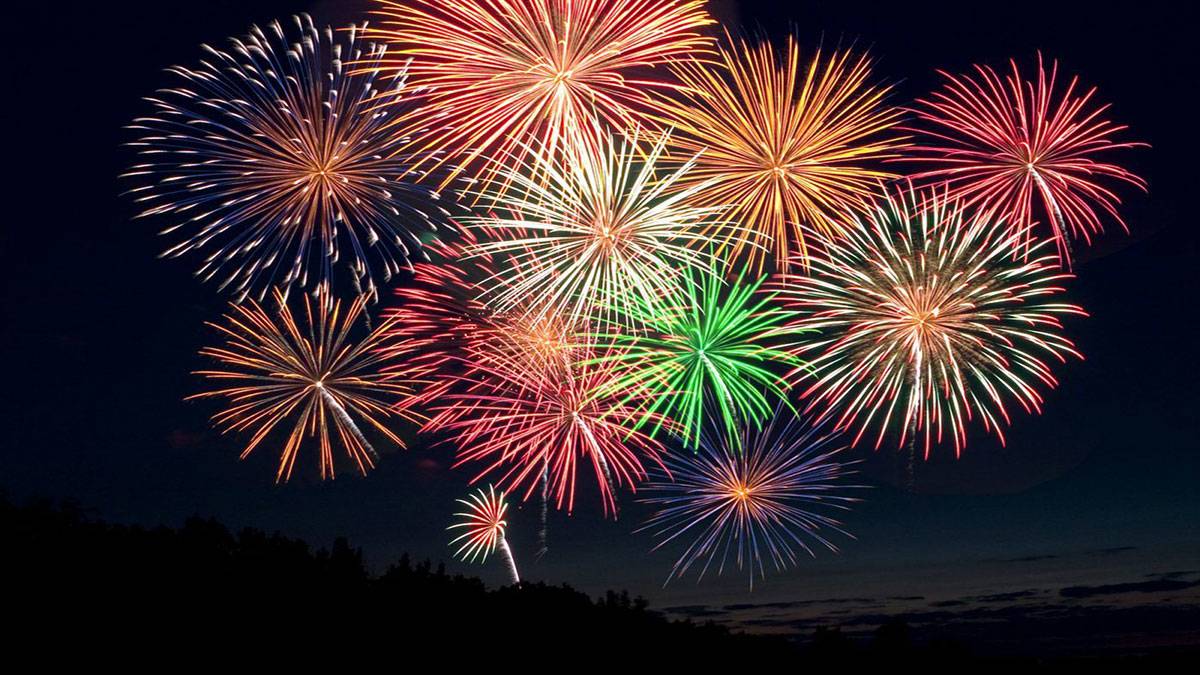multicolored fireworks in the night sky for fourth of july or new years eve celebration