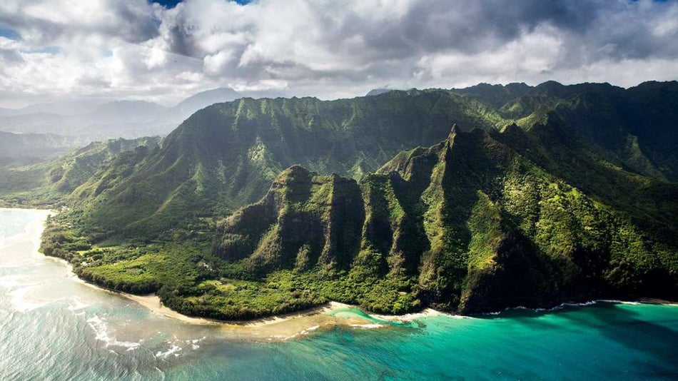 dark cloudy skies over aerial view of hawaiian islands and coastline in Hawaii, USA