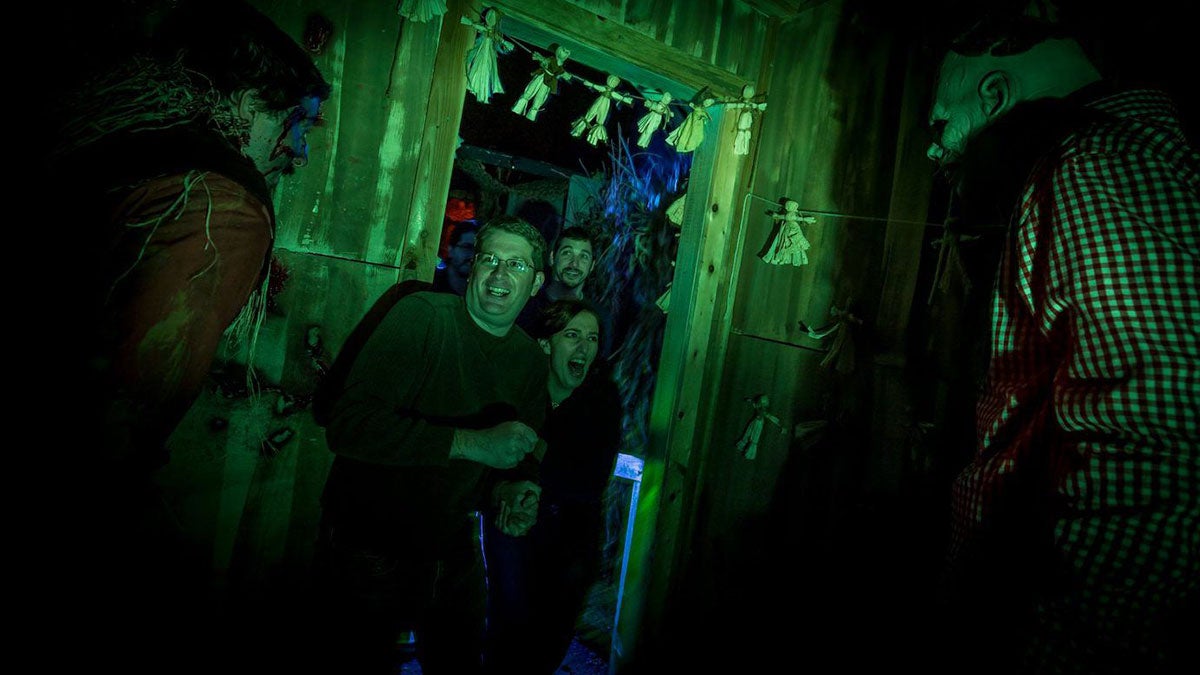 people screaming in terror inside of a haunted house at Howl-O-Scream in Busch Gardens in Williamsburg, VIrginia, USA