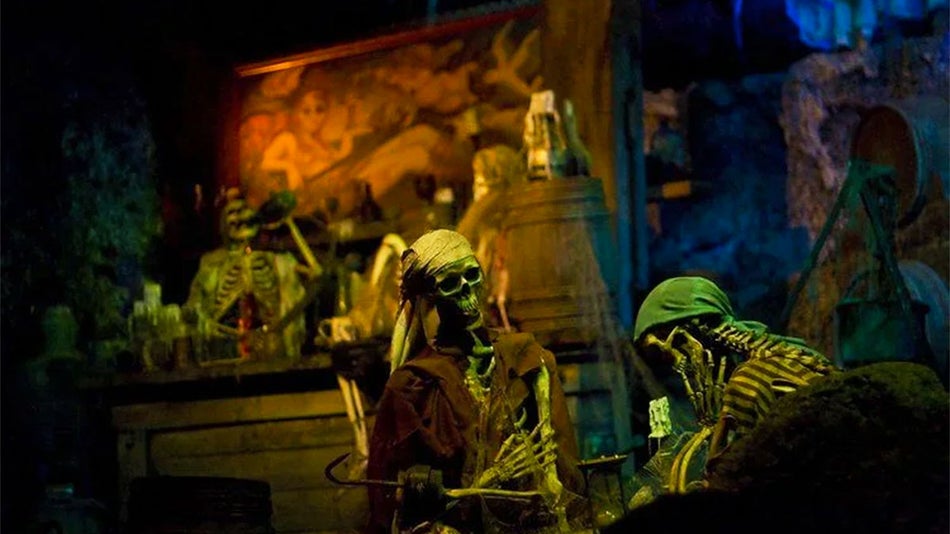 close up of skeletons sitting at a table at pirates of the caribbean attraction located in New Orleans Square Disneyland Los Angeles, California, USA