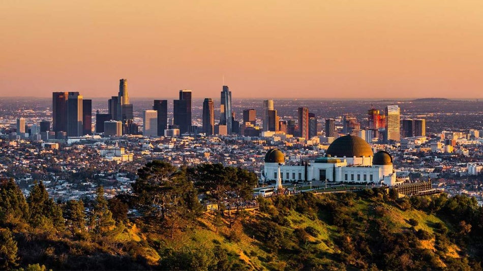 aerial sunset view over Griffith Observatory and downtown Los Angeles, California, USA