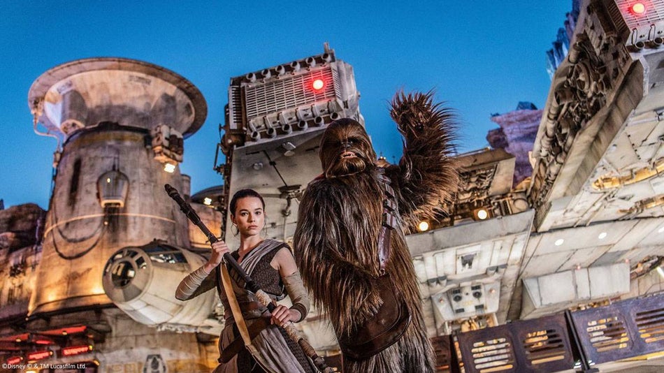 rae and chewbacca characters standing together in the star wars galaxy's edge in Walt Disney World Resort Orlando, Florida, USA