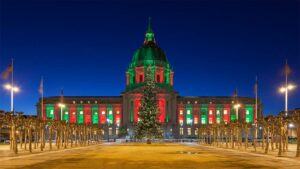 night time view of city hall with red and green christmas holiday lights in San Francisco, California, USA