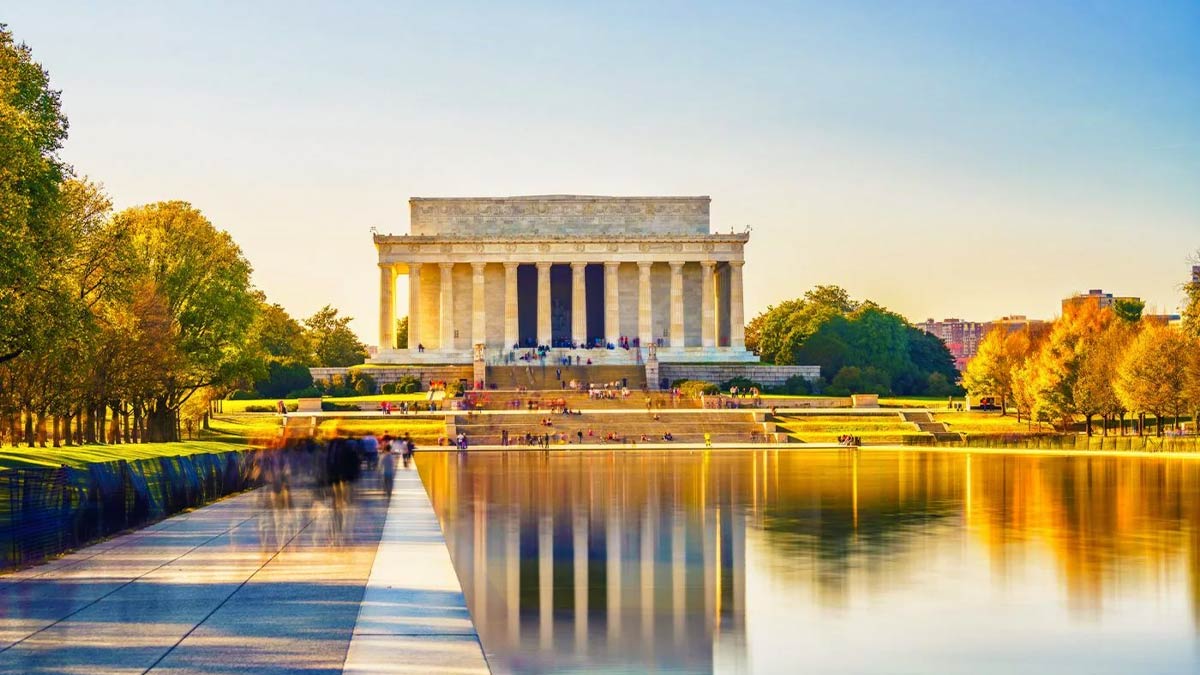 view of lincoln memorial with reflection pool during sunny autumn fall day in Washington, D.C., USA