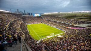 Wide shot of a large crowd watching a soccer game at Soldier Field in Chicago, Illinois, USA
