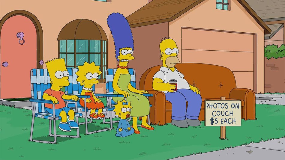 The Simpsons family sitting on their front lawn with a couch and a sign reading "PHOTOS ON COUCH $5 EACH"