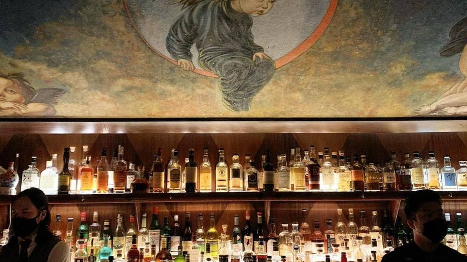 Close up shot of the liquor counter and part of the ceiling at Angel's Share Bar in NYC, New York