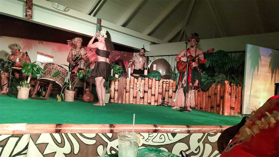 Musicians and hula dancers on stage at Polynesian Fire Luau and Dinner Show in Myrtle Beach, South Carolina, USA