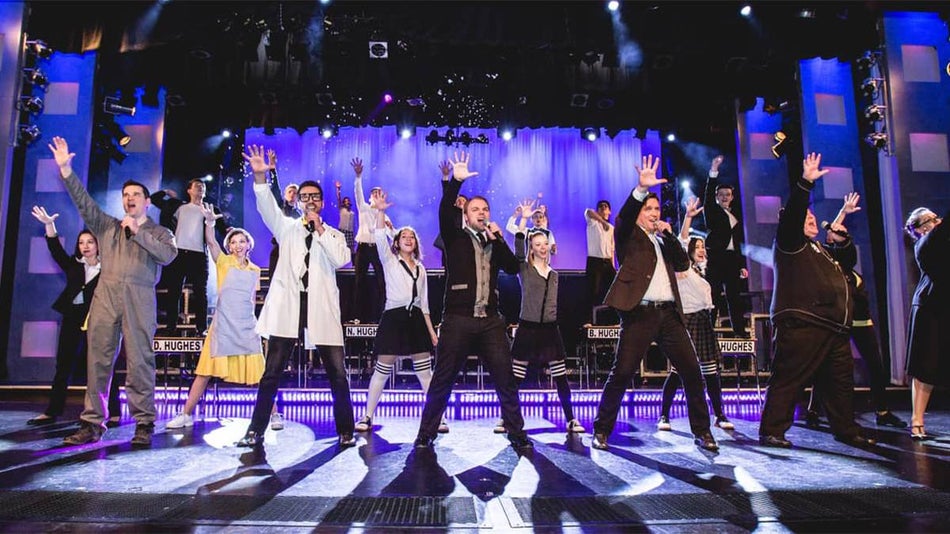 Show of performers on stage on singing at the Hughes Brothers Theatre in Branson, Missouri, USA