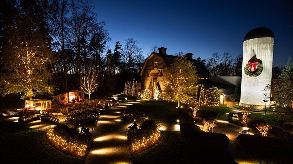 Wide shot of the Billy Graham Library decorated for Christmas at night in Charlotte, North Carolina, USA