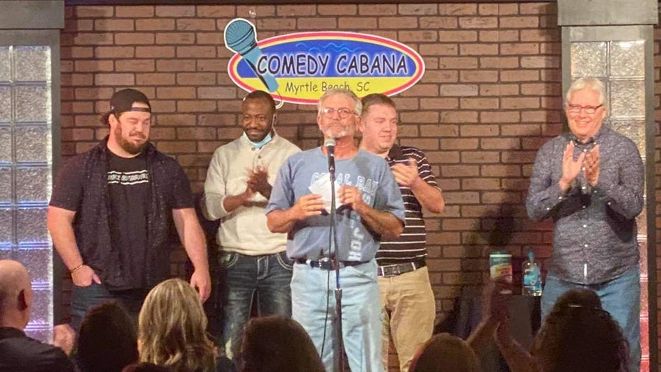 Five men on stage at the Comedy Cabana for open mic night in Myrtle Beach, South Carolina, USA