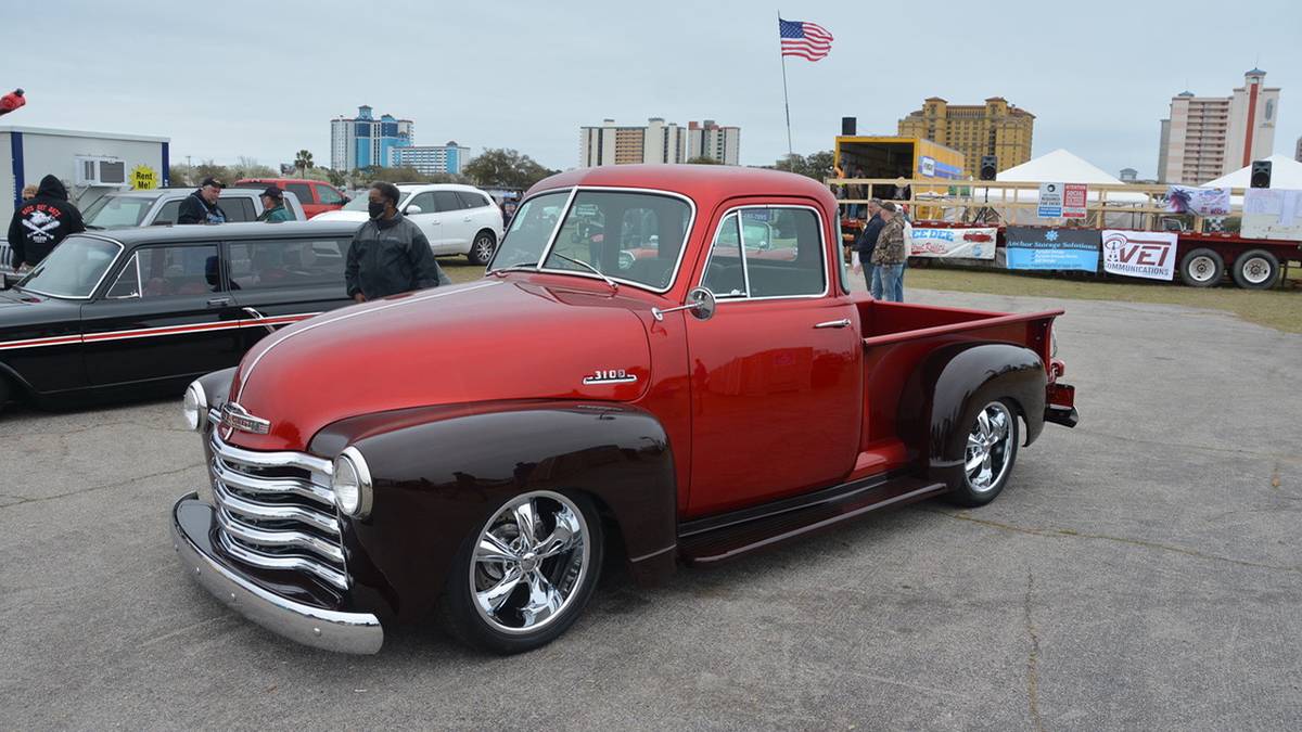 Close up photo of a shiny red and black vintage low rider truck at the Run to the Sun Car Show in Myrtle Beach, South Carolina, USA