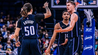 Close up photo of Orlando Magic played on the court high-fiving each other in Orlando, Florida, USA