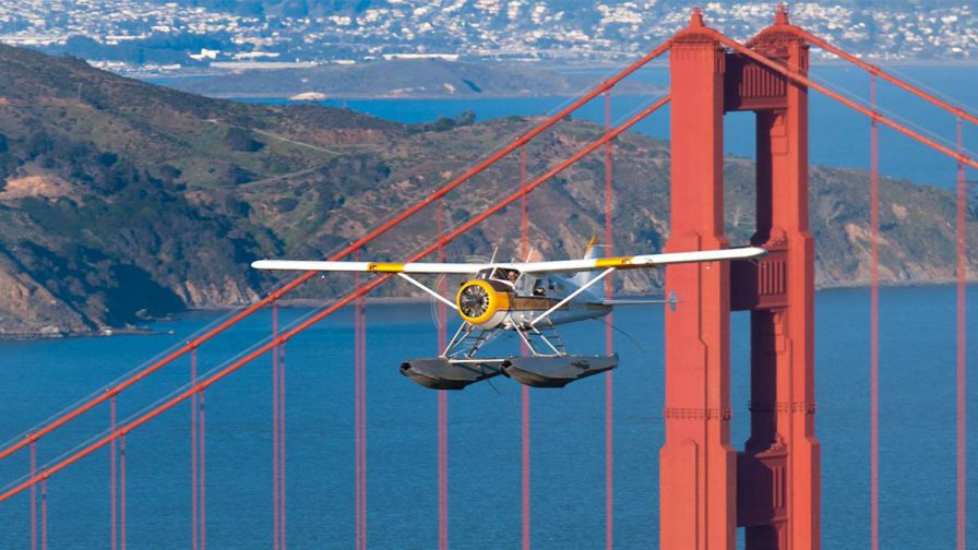 Seaplane flying in front of the Golden Gate Bridge in San Francisco, California, USA