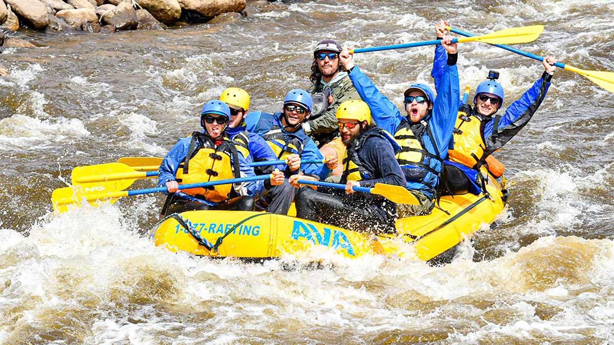 group of people on raft holding oars for AVA White Water Rafting in Buena Vista, Colorado, USA