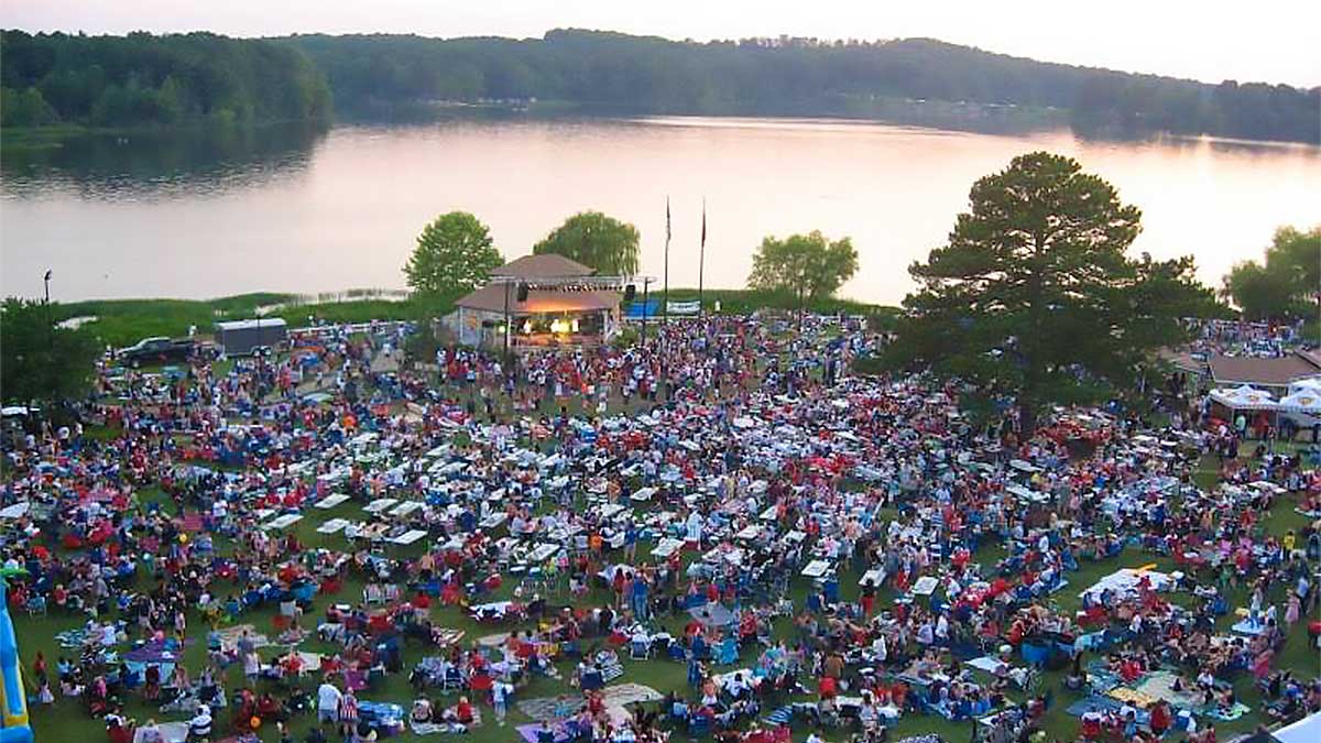 aerial view of crowd at Acworths 4th of July Concert and Fireworks and body of water in Atlanta, Georgia, USAr