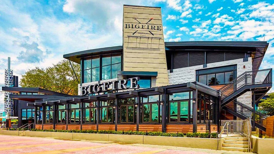 exterior of Bigfire Restaurant Universal CityWalk with blue sky and clouds during day in Orlando, Florida, USA
