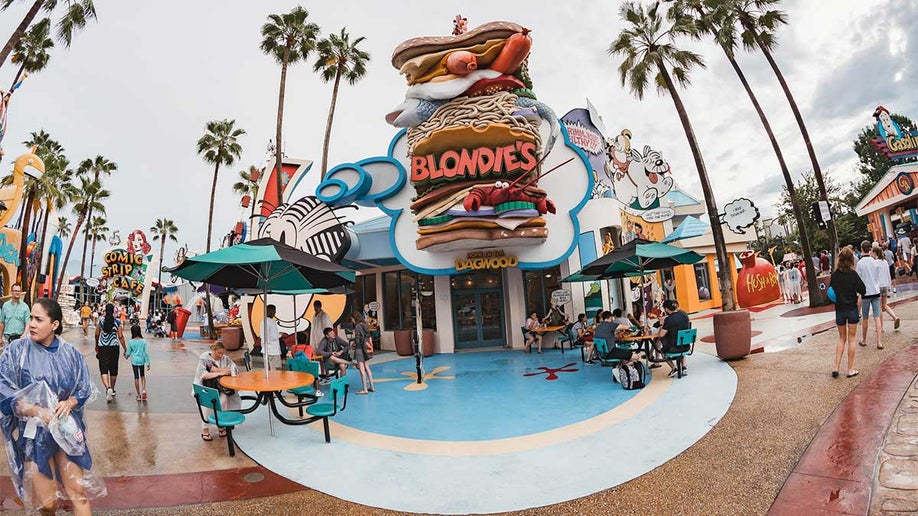 fisheye shot of exterior of Blondies at Universal Orlando with people seated at outdoor tables in Orlando, Florida, USA