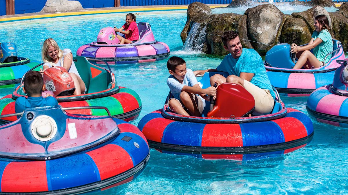 people aboard Bumper Boats ride on large pool at boca raton in Miami, Florida, USA