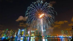 a photo of a fireworks in display in the city