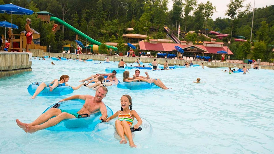 people on swim rings in large pool at Mountain Waves Pool in Dollywood Splash Country, Pigeon Forge, Tennessee, USA