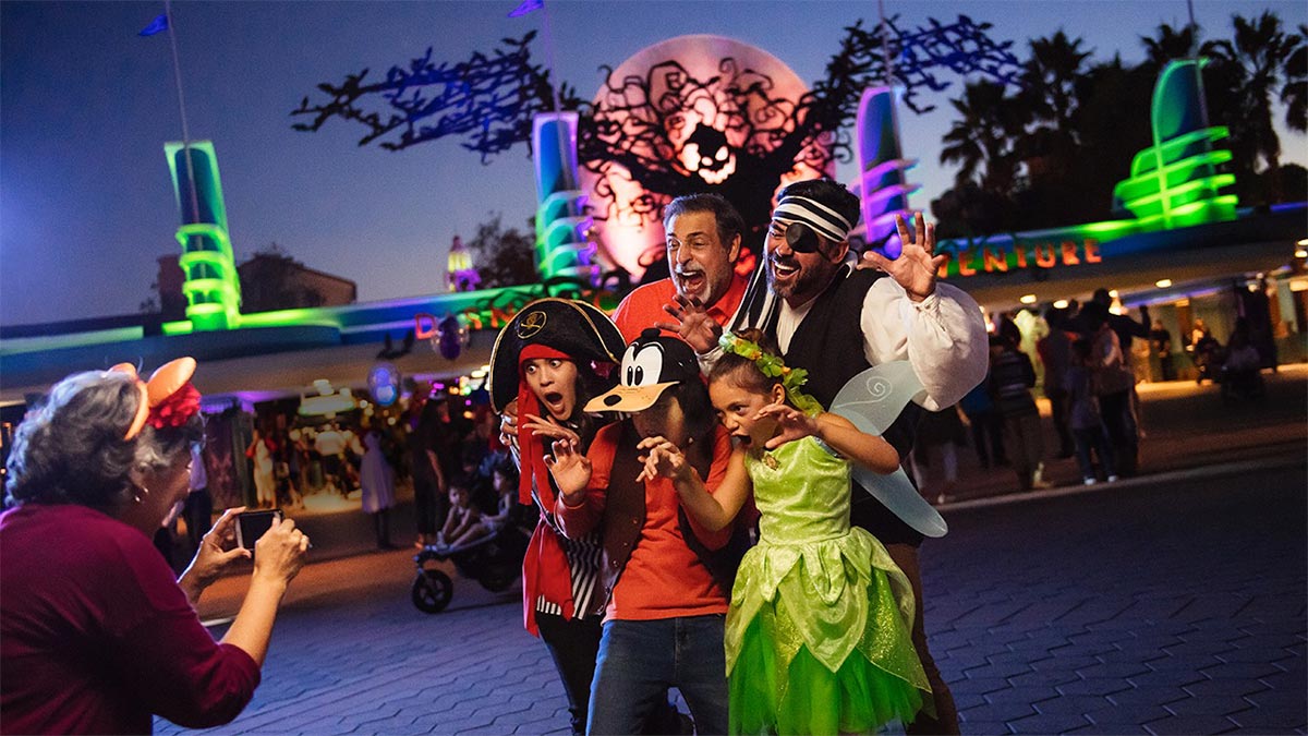 A stolen shot of a family wearing pirate attire while the old woman takes a shot of them