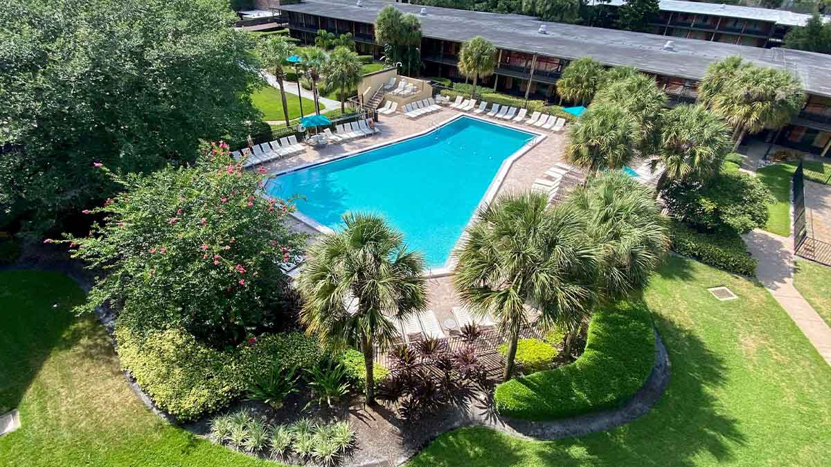 aerial view of Rosen Inn International Drive with view of pool surrounded by trees in Orlando, Florida, USA