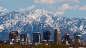 buildings and trees with mountains in background in Salt Lake City, Utah, USA