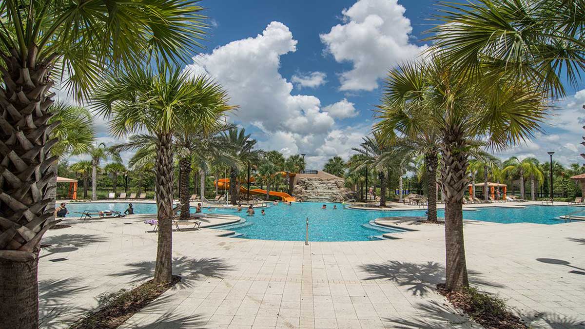 view of pool with palm trees at Solterra Resort Orlando Global Vacation Rentals in Orlando, Florida, USA