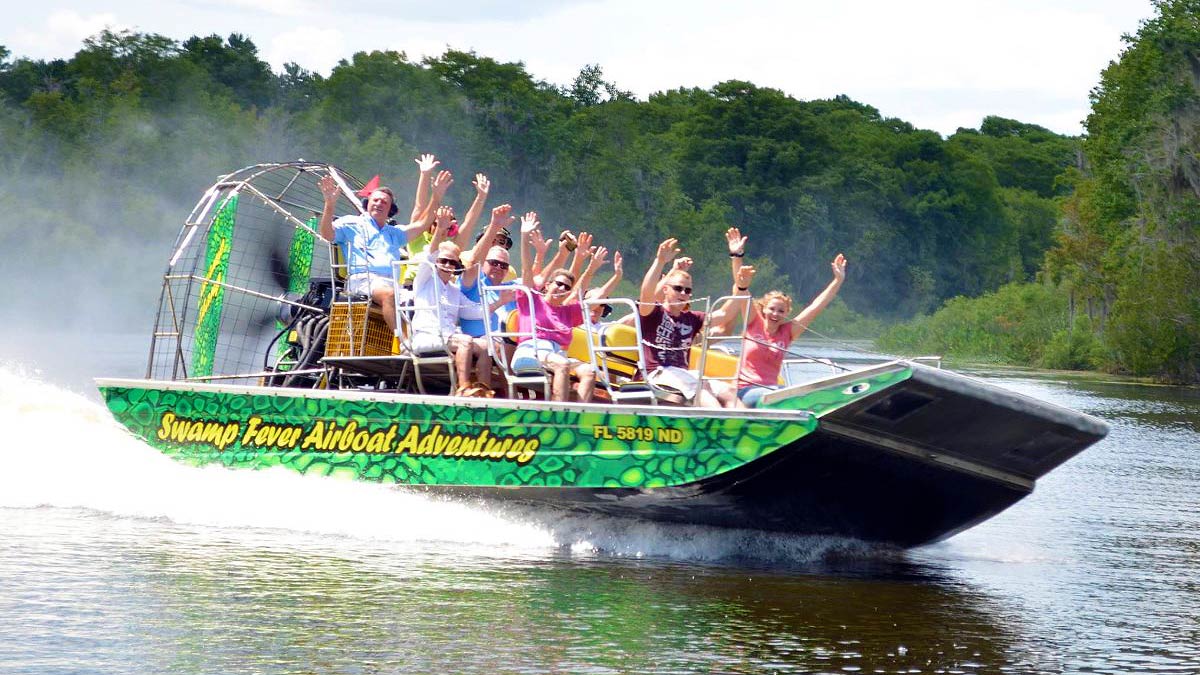 people are enjoying the ride of an airboat