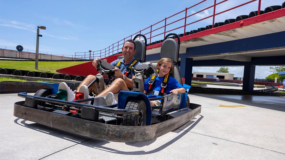 father and daughter racing on Thunder Road Go Kart at boomers boca raton in Miami, Florida, USA
