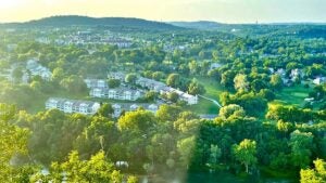 view overlooking Branson filled with trees, houses, hills from Branson Scenic Overlook in Branson, Missouri, USA