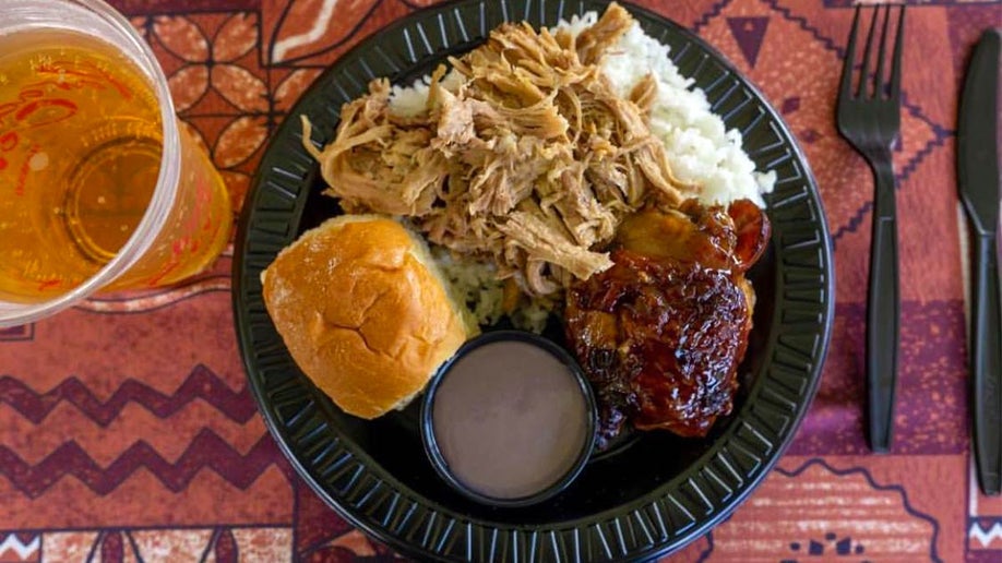 close up of plate of food and drink at Paradise Cove Luau in Oahu, Hawaii, USA