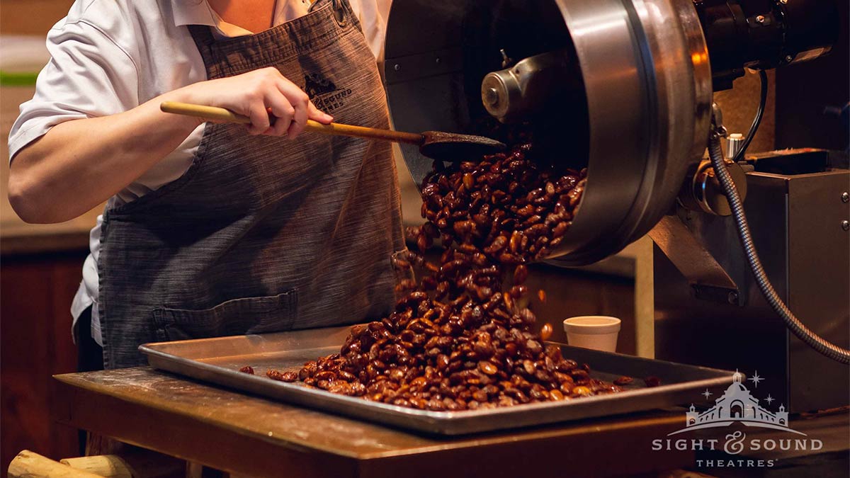 close up of Glazed Almonds being transfered to pan at Sight and Sound Theater in Branson, Missouri, USA