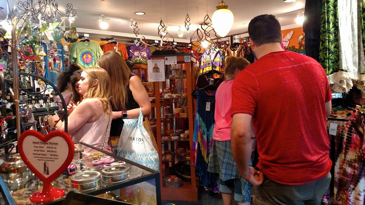 Tourists inside a store with a range of goods on display