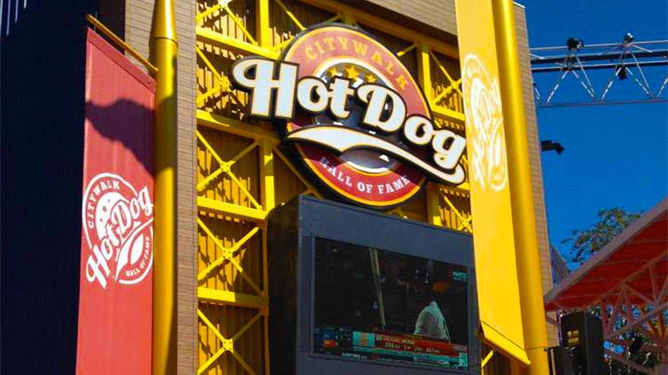 close up of sign of Hot Dog Hall of Fame with screen in bottom at Universal CityWalk in Orlando, Florida, USA